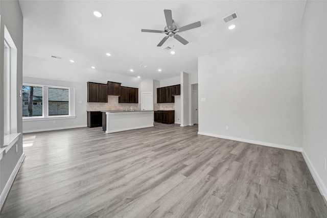 unfurnished living room with light hardwood / wood-style floors and ceiling fan