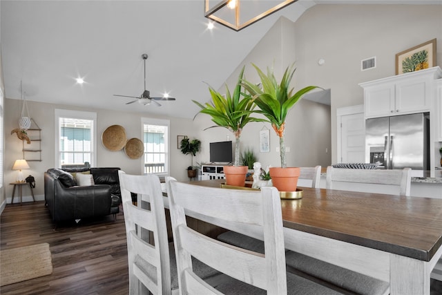 dining room with ceiling fan and dark hardwood / wood-style flooring