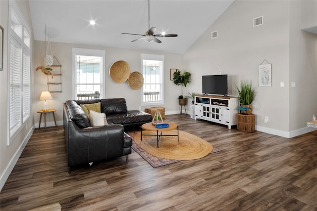 living room featuring ceiling fan, high vaulted ceiling, and dark hardwood / wood-style flooring