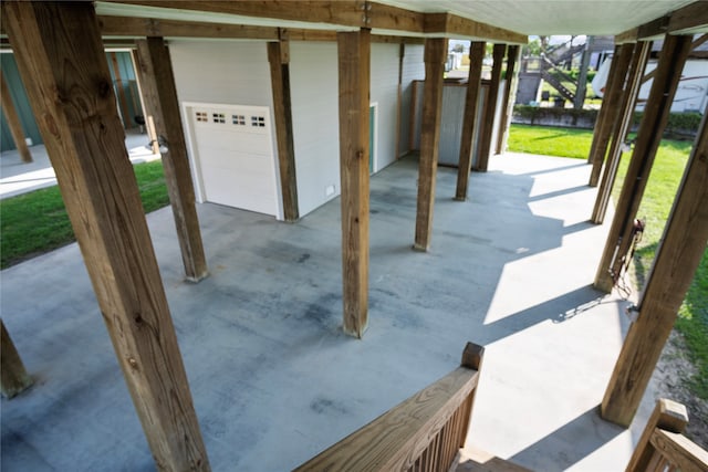 view of patio featuring a garage