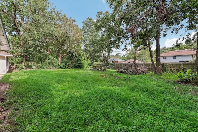 view of yard featuring fence