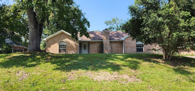 ranch-style house with a front lawn