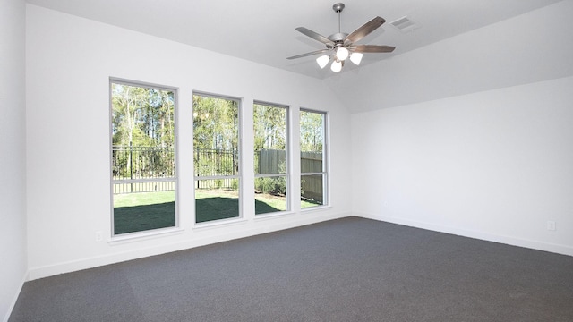 carpeted empty room featuring ceiling fan and lofted ceiling