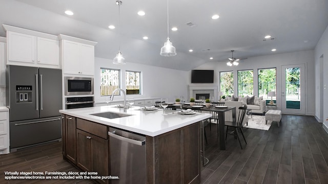 kitchen with white cabinets, sink, ceiling fan, dark hardwood / wood-style floors, and stainless steel appliances