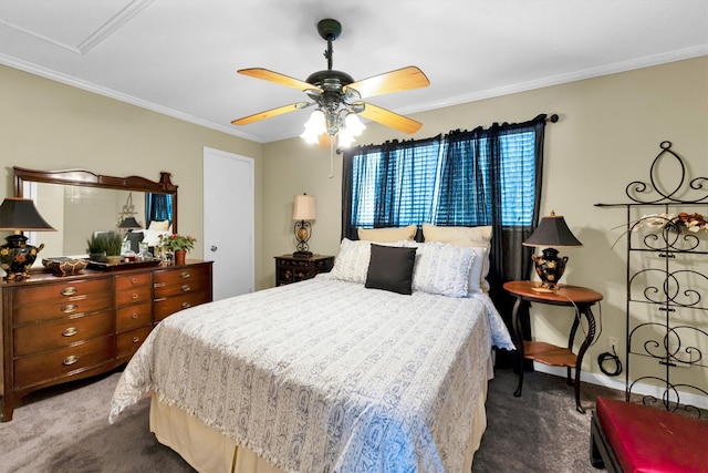 carpeted bedroom featuring ornamental molding and ceiling fan