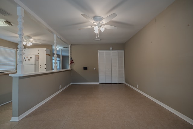 spare room with ceiling fan