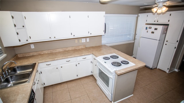 kitchen with sink, white appliances, and white cabinets