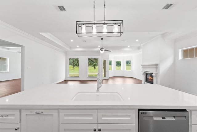 kitchen featuring visible vents, dishwasher, ceiling fan, open floor plan, and a sink