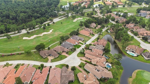 birds eye view of property featuring a water view, a residential view, and golf course view