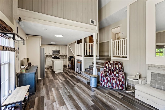 living room with dark hardwood / wood-style floors