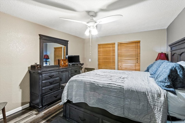 bedroom featuring ceiling fan, wood-type flooring, and a textured ceiling