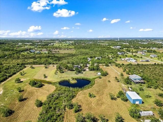 bird's eye view with a water view and a rural view