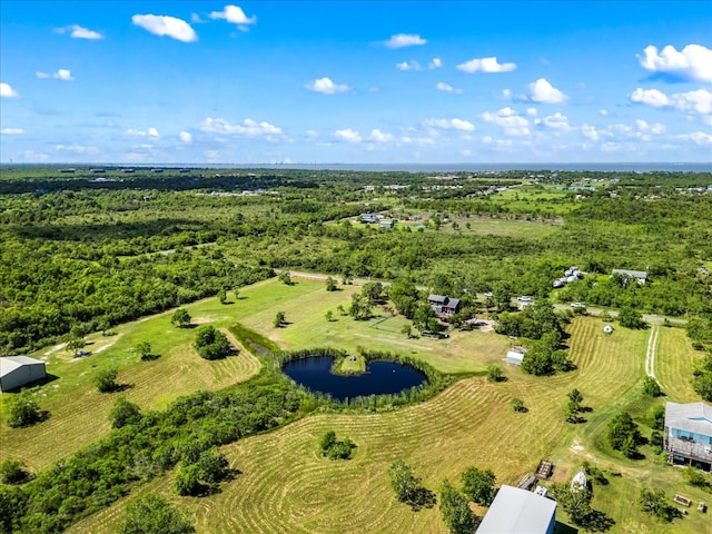 drone / aerial view featuring a water view and a rural view