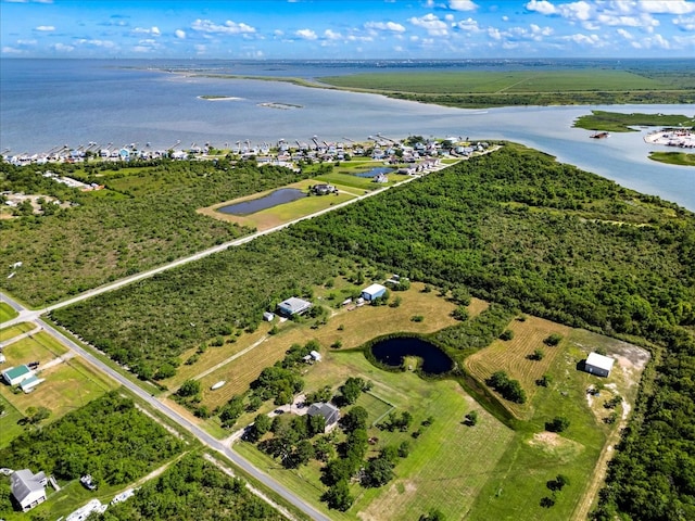 aerial view with a water view and a rural view