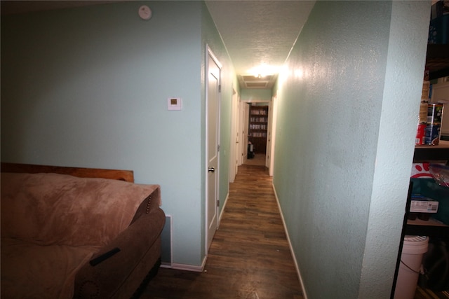 hall with dark wood-type flooring