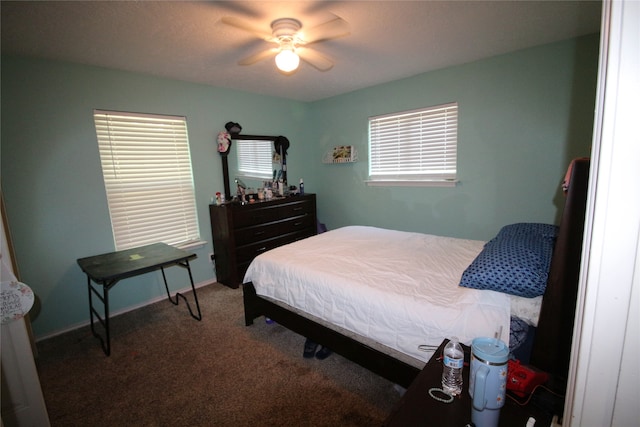 bedroom with ceiling fan and carpet floors