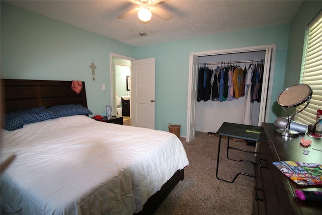 bedroom featuring ceiling fan, a closet, and carpet flooring