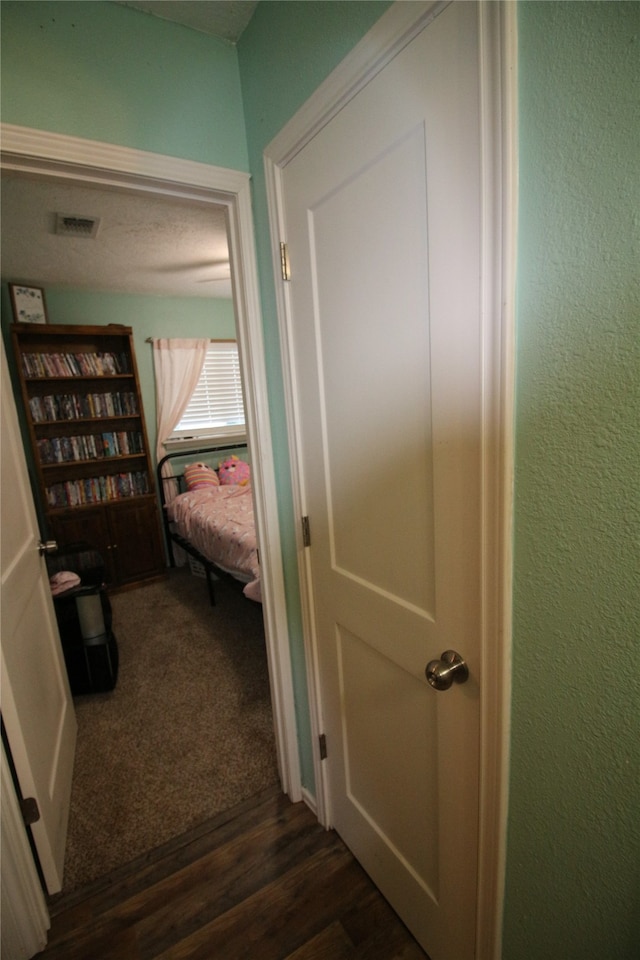 hallway featuring dark hardwood / wood-style floors