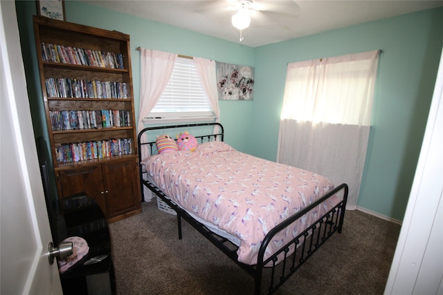 bedroom featuring ceiling fan and carpet