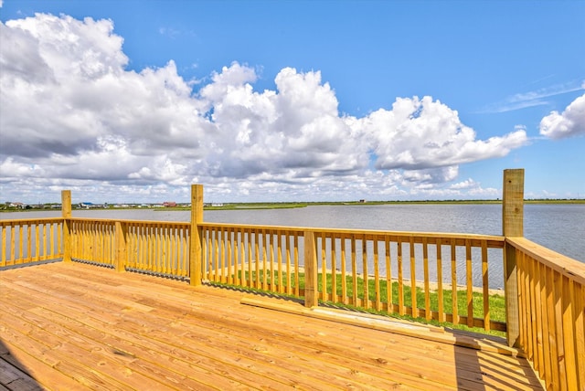 wooden terrace with a water view