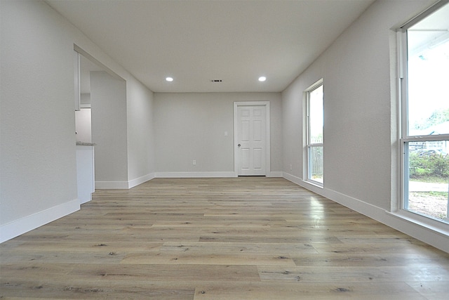 unfurnished room with light hardwood / wood-style flooring