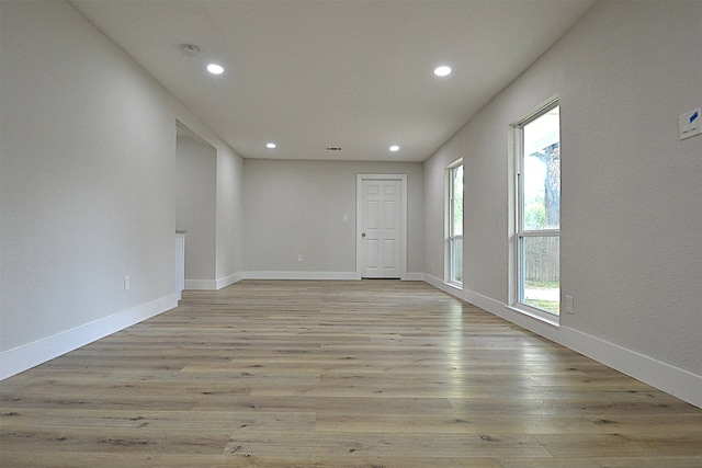 unfurnished room featuring light hardwood / wood-style flooring