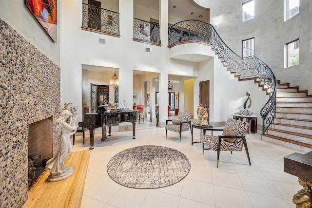 tiled entrance foyer with a chandelier