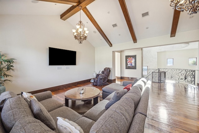 living room with beamed ceiling, hardwood / wood-style floors, and a wealth of natural light