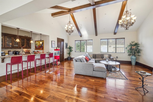 living room with dark hardwood / wood-style flooring, a notable chandelier, beam ceiling, and high vaulted ceiling