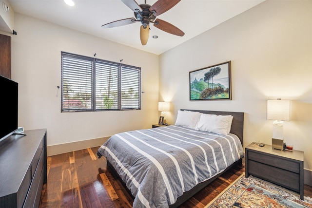 bedroom featuring dark hardwood / wood-style flooring and ceiling fan