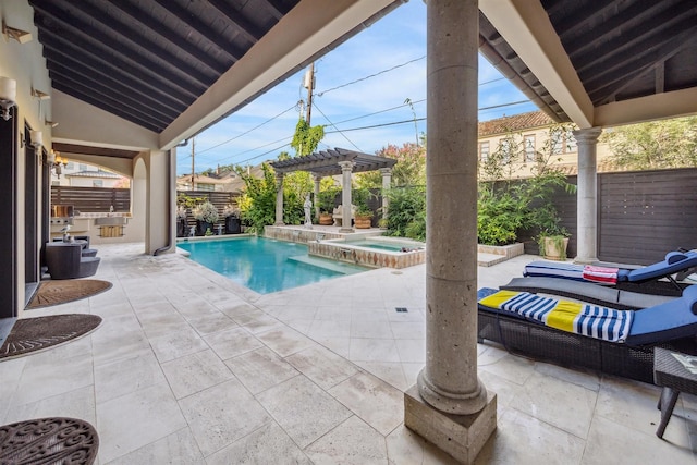 view of swimming pool with an in ground hot tub, area for grilling, a pergola, and a patio area