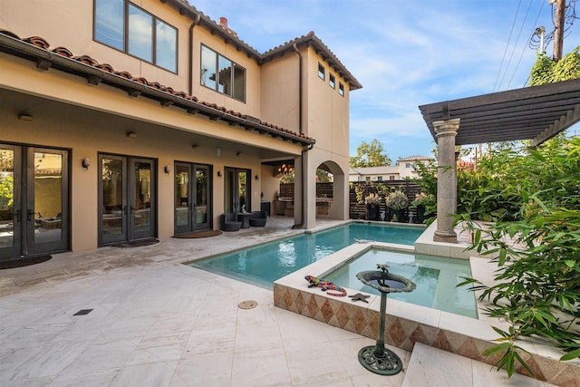 view of swimming pool featuring french doors, an in ground hot tub, a pergola, and a patio