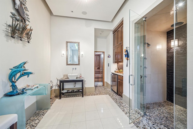 bathroom featuring an enclosed shower, vanity, and tile patterned floors