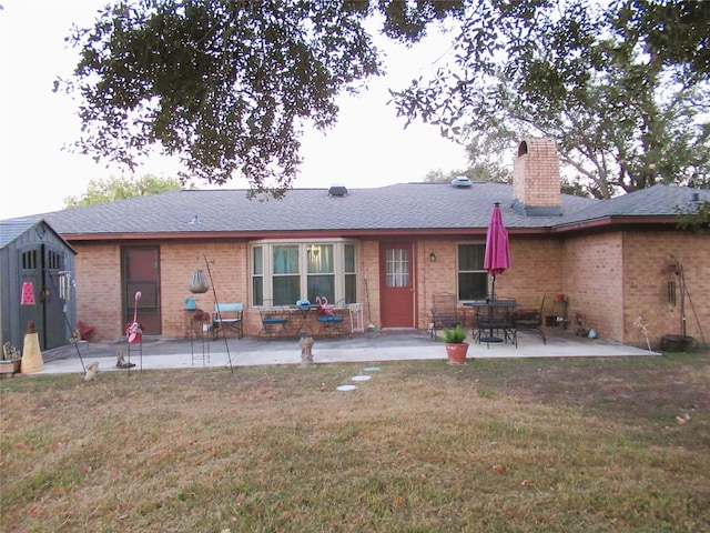 back of property featuring a patio and a lawn