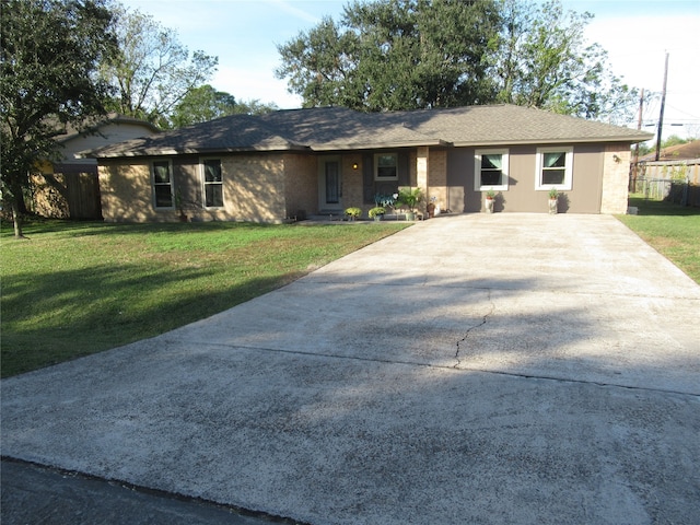 ranch-style house with a front lawn