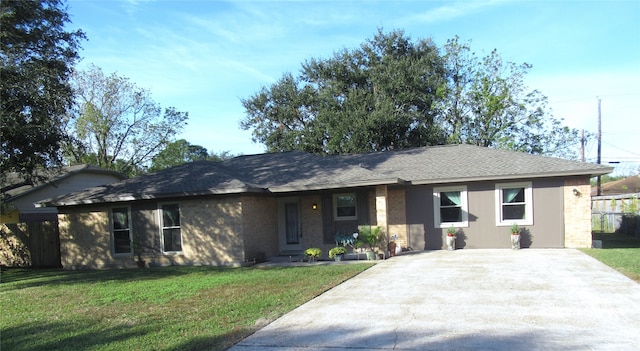 ranch-style home with a front yard