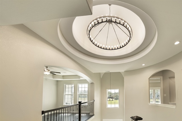 details with ceiling fan with notable chandelier