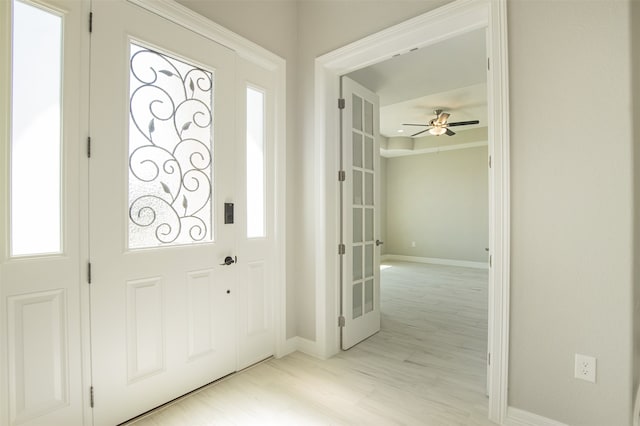 entryway with light hardwood / wood-style flooring and ceiling fan