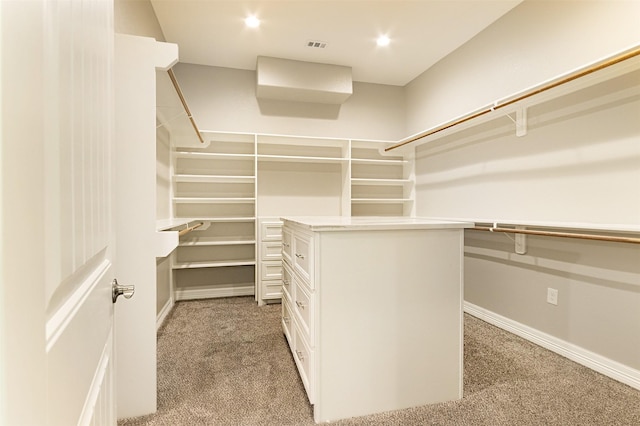 walk in closet featuring carpet floors