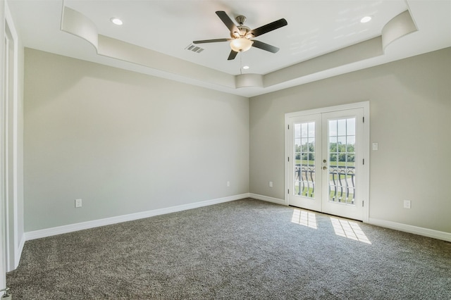 1714 Mackey Dr, Dickinson, TX 77539 - unfurnished room featuring carpet floors, french doors, a ceiling fan, a tray ceiling, and baseboards