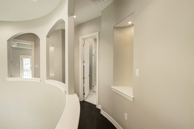 hallway featuring dark hardwood / wood-style flooring