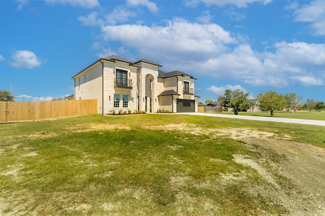 view of front facade with a front lawn and a garage