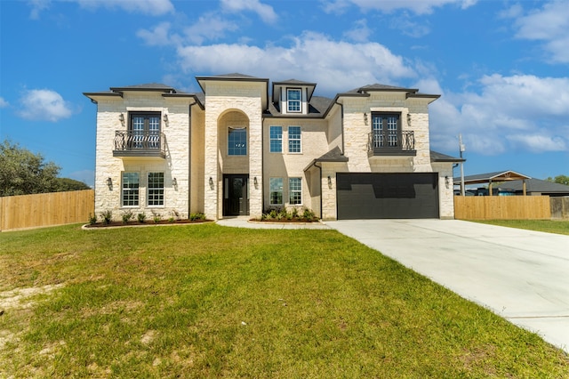 view of front of house with a balcony, a front yard, and a garage