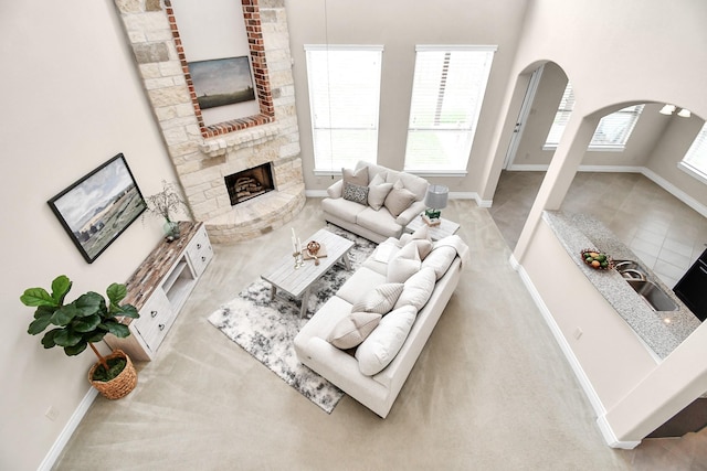 carpeted living room with a fireplace