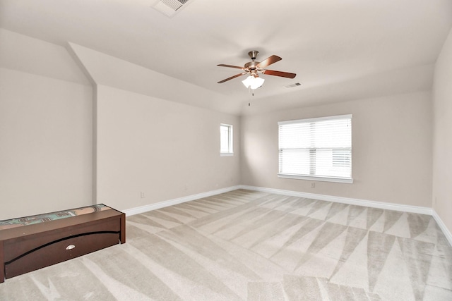 empty room with light colored carpet and ceiling fan