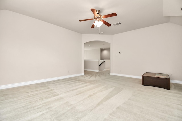 carpeted spare room featuring ceiling fan