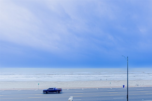 property view of water featuring a beach view