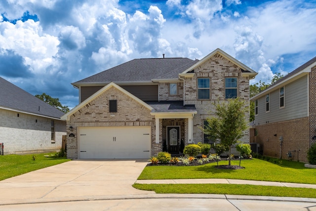 craftsman-style home with central air condition unit and a front yard