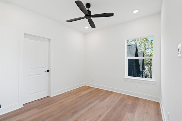 unfurnished room featuring light hardwood / wood-style flooring and ceiling fan