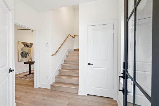 stairway featuring hardwood / wood-style floors